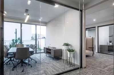 an office with a table and chairs and glass walls at Blueground Coral Gables pool wd nr Vizcaya MIA-125 in Miami