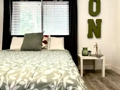 a bedroom with a bed and a large window at B10 7 MIN FROM MIAMI BEACH, 1 Bed Apartment, Design District & Wynwood in Miami