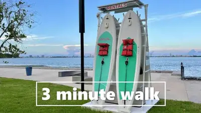 a sign that says minute walk with two boats at B10 7 MIN FROM MIAMI BEACH, 1 Bed Apartment, Design District & Wynwood in Miami