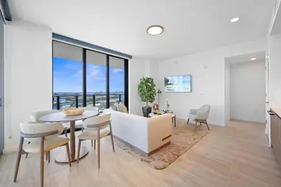 a dining room and living room with a table and chairs at NOK Classy 2BR in Miami Beach in Miami Beach