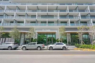 three cars parked in front of a building at NOK Classy 2BR in Miami Beach in Miami Beach