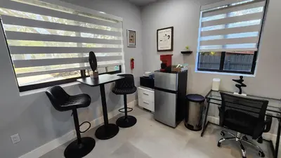 a room with three chairs and a desk and a refrigerator at NEW house in Miami Casa Calle 19 in Miami