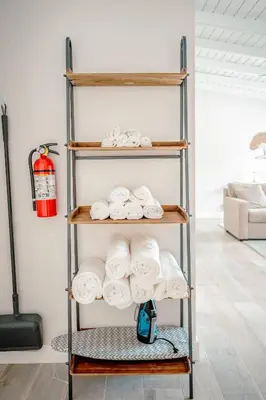 a towel rack with towels on it in a room at Bimini Bliss Waterfront Pool Retreat in Fort Lauderdale