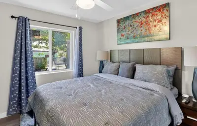 a bedroom with a large bed and a window at New 3BR in Central Miami Location for Family & Groups in Miami