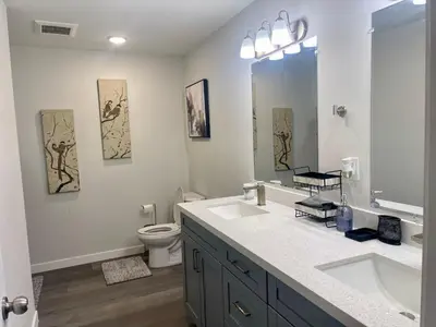 a bathroom with two sinks and a toilet at New 3BR in Central Miami Location for Family & Groups in Miami