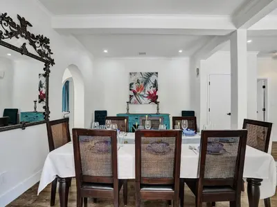 a dining room with a table and chairs at Classic 5 Bedroom 4 Bathroom Pool Home in Hollywood