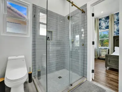 a bathroom with a shower and a toilet at Classic 5 Bedroom 4 Bathroom Pool Home in Hollywood