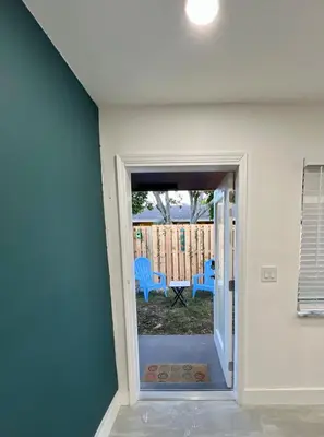 a door leading to a yard with a patio at 20 OFF BLUE WAVE 10min Beach and Airport in Fort Lauderdale