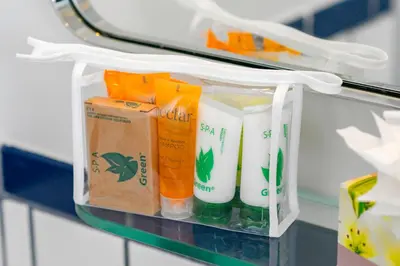 a shelf with a bunch of cleaning products on it at Bluebird Suites at The Apex Miami in Miami Beach