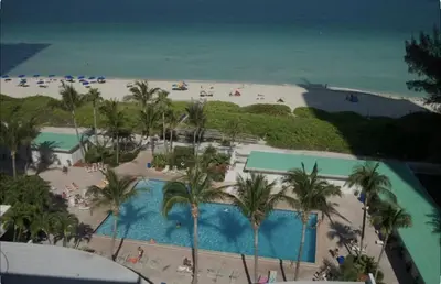an aerial view of a resort with a beach at Miami Beach-Front with Amazing Pool in Miami Beach
