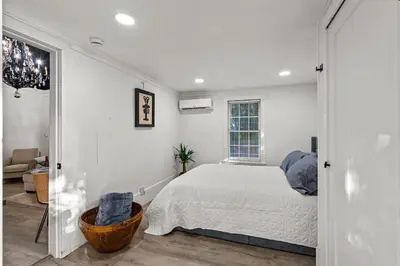 a white bedroom with a bed and a window at Newly Renovated Home- Sailboat Bend - Walk to Las Olas - 4 Miles to Beach in Fort Lauderdale