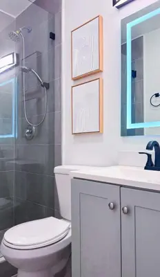 a bathroom with a toilet and a sink and a shower at The Hideaway - Wilton Manors in Fort Lauderdale