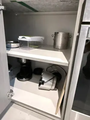 a kitchen shelf with a pot and pans on it at Stylish Urban 5350 Park Doral in Miami