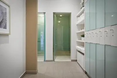 a bathroom with blue cabinets and a walk in shower at Spacious 1BR Loft Villa - Pool Golf - Doral Downtown in Miami