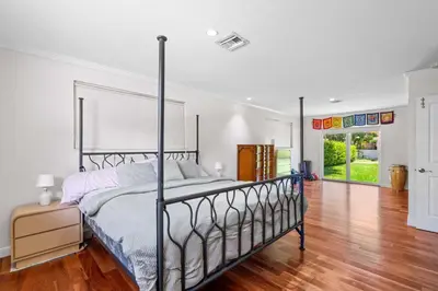 a bedroom with a metal bed in a room at Brazilian Style Getaway 2 Minutes to Beach in Hollywood