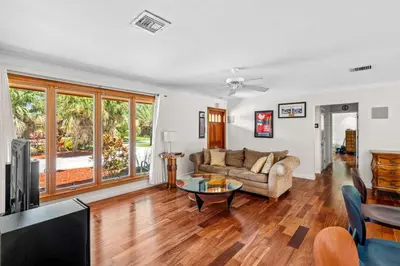 a living room with a couch and a table at Brazilian Style Getaway 2 Minutes to Beach in Hollywood