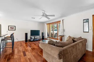 a living room with a couch and a television at Brazilian Style Getaway 2 Minutes to Beach in Hollywood