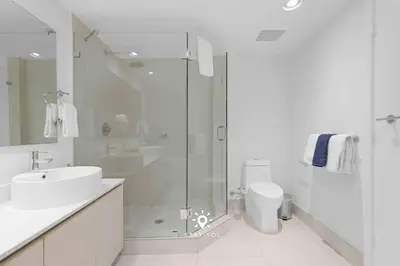 a bathroom with a shower and a sink and a toilet at Apt with Private Balcony - Incredible Pool in Hallandale Beach