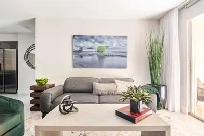 a living room with a couch and a table at The Yacht Club at Aventura Miami 8304 in Aventura