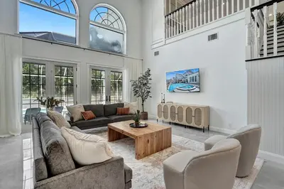 a living room with two couches and a coffee table at 6BR Elegant Hollywood Lakes Mansion with Private Pool & Spa in Hollywood