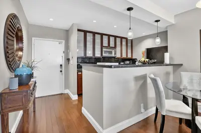 a kitchen and dining room with a table and chairs at Beach Haven Condo for 2 in Fort Lauderdale
