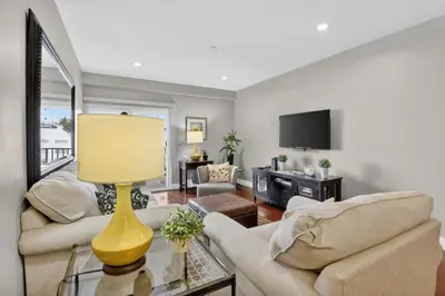 a living room with two couches and a tv at Beach Haven Condo for 2 in Fort Lauderdale