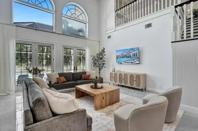 a living room with a couch and a coffee table at 6BR Elegant Hollywood Lakes Mansion with Pool & Spa home in Hollywood