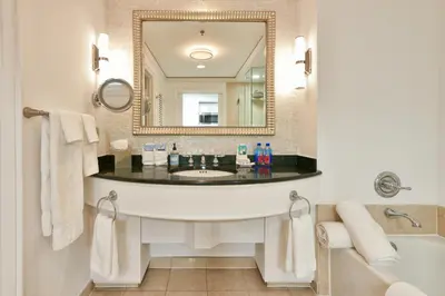 a bathroom with a large sink and a mirror at Luxury Studio at The Ritz-Carlton Key Biscayne in Miami