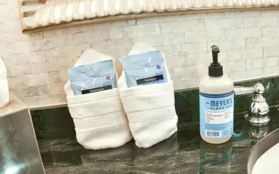 a pair of socks sitting on a counter next to a sink at Luxury Studio at The Ritz-Carlton Key Biscayne in Miami
