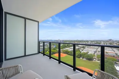 a balcony with a view of a baseball field at NOK Amazing 1 BR in Miami Beach in Miami Beach