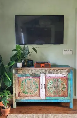 a wooden dresser with a tv on top of it at LUSH TROPICAL STUDIO in FT LAUDEDALE'S HISTORICAL SAILBOAT BEND NEIGHBORHOOD in Fort Lauderdale