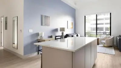 a kitchen with a white island in a room at Landing Chic 2BD Clubhouse Yoga Studio in North Miami