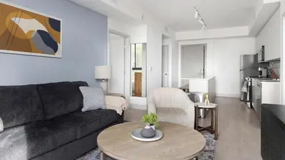 a living room with a couch and a table at Landing Chic 2BD Clubhouse Yoga Studio in North Miami