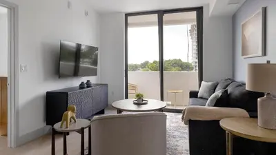a living room with a couch and a tv at Landing Chic 2BD Clubhouse Yoga Studio in North Miami