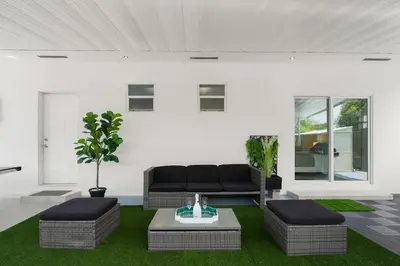 a living room with a couch and a table at Villa Gabriel Modern, Family Home Just 15 minutes downtown Miami in Miami