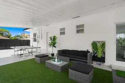 a living room with a couch and a table at Villa Gabriel Modern, Family Home Just 15 minutes downtown Miami in Miami