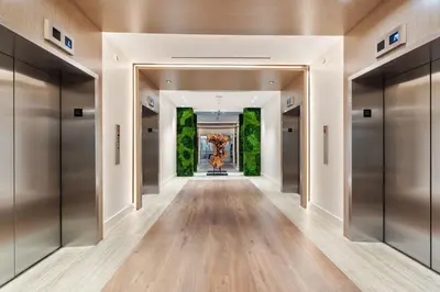 a hallway with elevator doors in a building at Amazing Ocean and 1 Hotel pool Views 2BR 3BA w Balcony in Miami Beach
