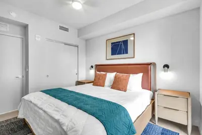 a bedroom with a large bed in a room at Luxury 2 Bedroom Corner Unit Crosby Rooftop Pool in Miami