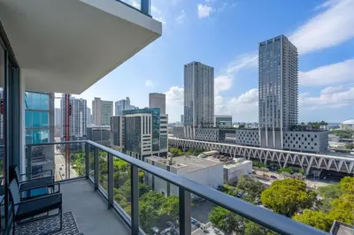 a balcony with a view of the city at Luxury 2 Bedroom Corner Unit Crosby Rooftop Pool in Miami