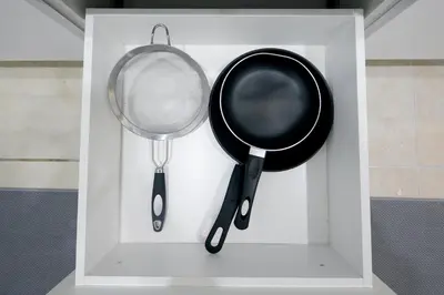 a white box with two frying pans and a spatula at Historical Little Havana 2 Bed with Parking in Miami