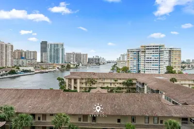 a view of a city with a river and buildings at Amazing Apartment with Bay View Balcony Near Beach in Hallandale Beach
