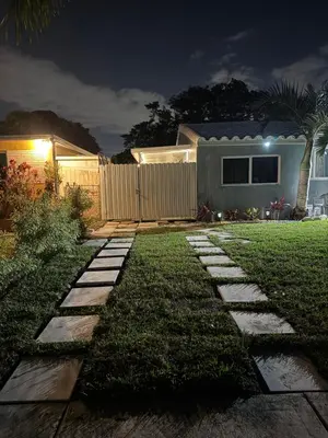 a garden at night with a stone walkway at Private Studio with Patio-King Bed, Near Beach & Casinos in Hollywood