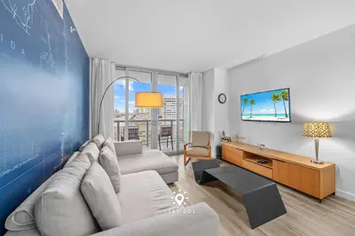 a living room with a couch and a table at Peaceful Bay View Apartment Near Beach in Hallandale Beach