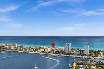 a red balloon in the water next to a city at Santorini Blu Stylish Coastal Studio on the Beach in Hollywood