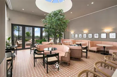 a restaurant with tables and chairs in a room at 1BR Apartment New Luxury in Miami