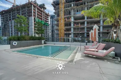 a swimming pool on the roof of a building at Stylish Miami Studio Perfect for City Living in Miami