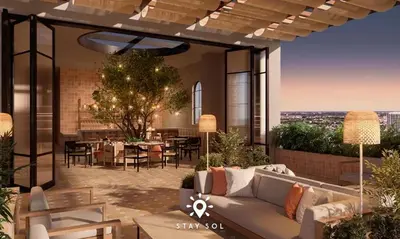 a living room with a couch and a table at Downtown Retreat Pools Spa & Lounges Miami in Miami