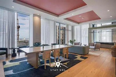 a living room with a large table and chairs at Downtown Retreat Pools Spa & Lounges Miami in Miami