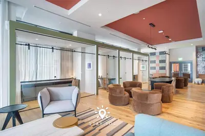 a living room with chairs and a couch and a table at Downtown Retreat Pools Spa & Lounges Miami in Miami