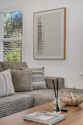 a living room with a couch and a table at Victoria Park Oasis Walk to las Olas Beach in Fort Lauderdale